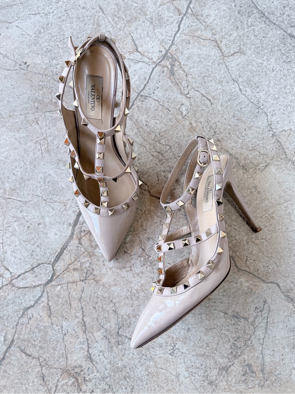 Valentino Garavani Rockstud Nude Patent Leather Rockstud T-Strap Caged Pumps